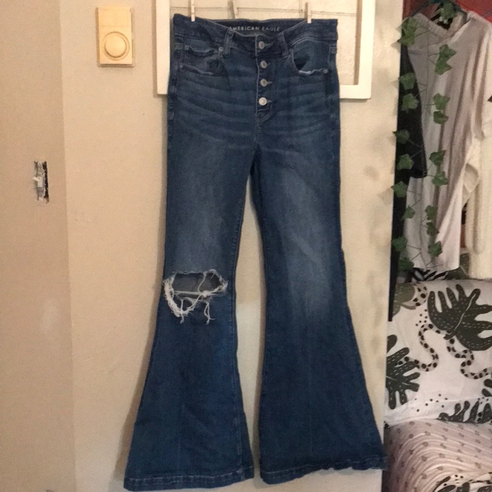 a light blue American Eagle flare ripped jeans. the size is size four. stretchy